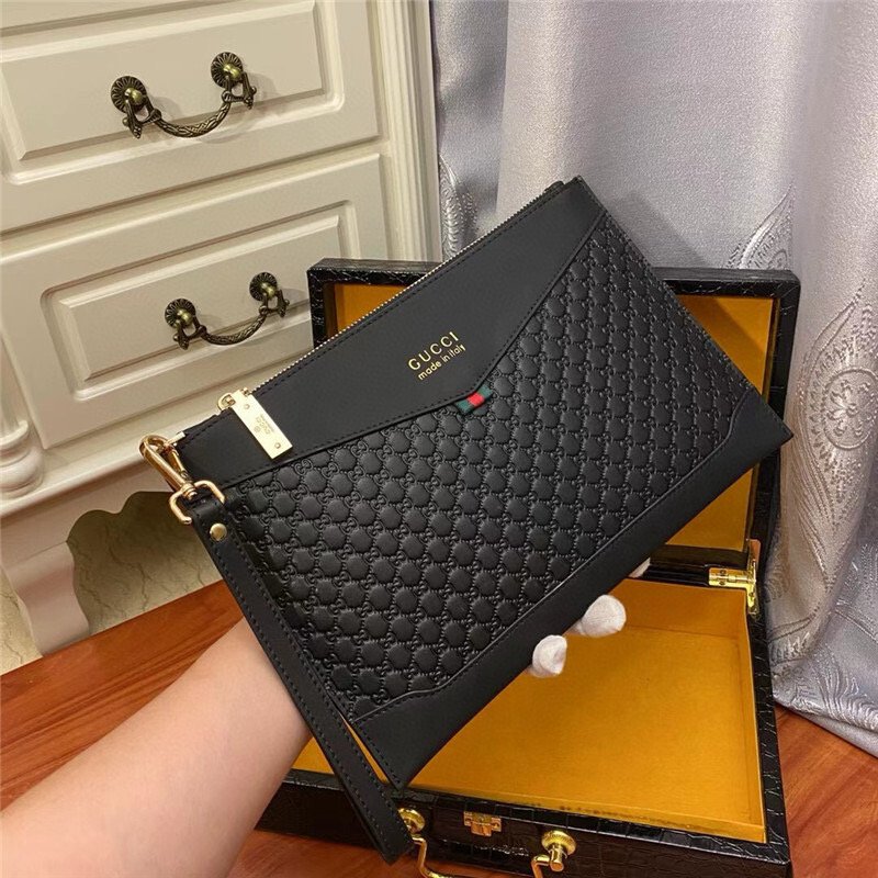 Gucci GG-embossed black leather pouch